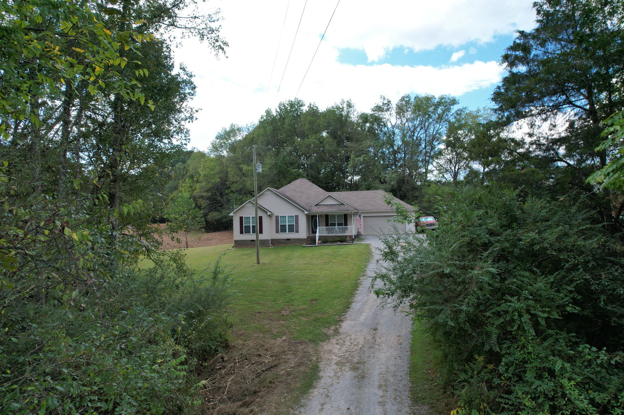 121 Wells Lee Road Elora, TN 37328 - Photo 38 of 48 a view of a big house with a big yard plants and large trees
