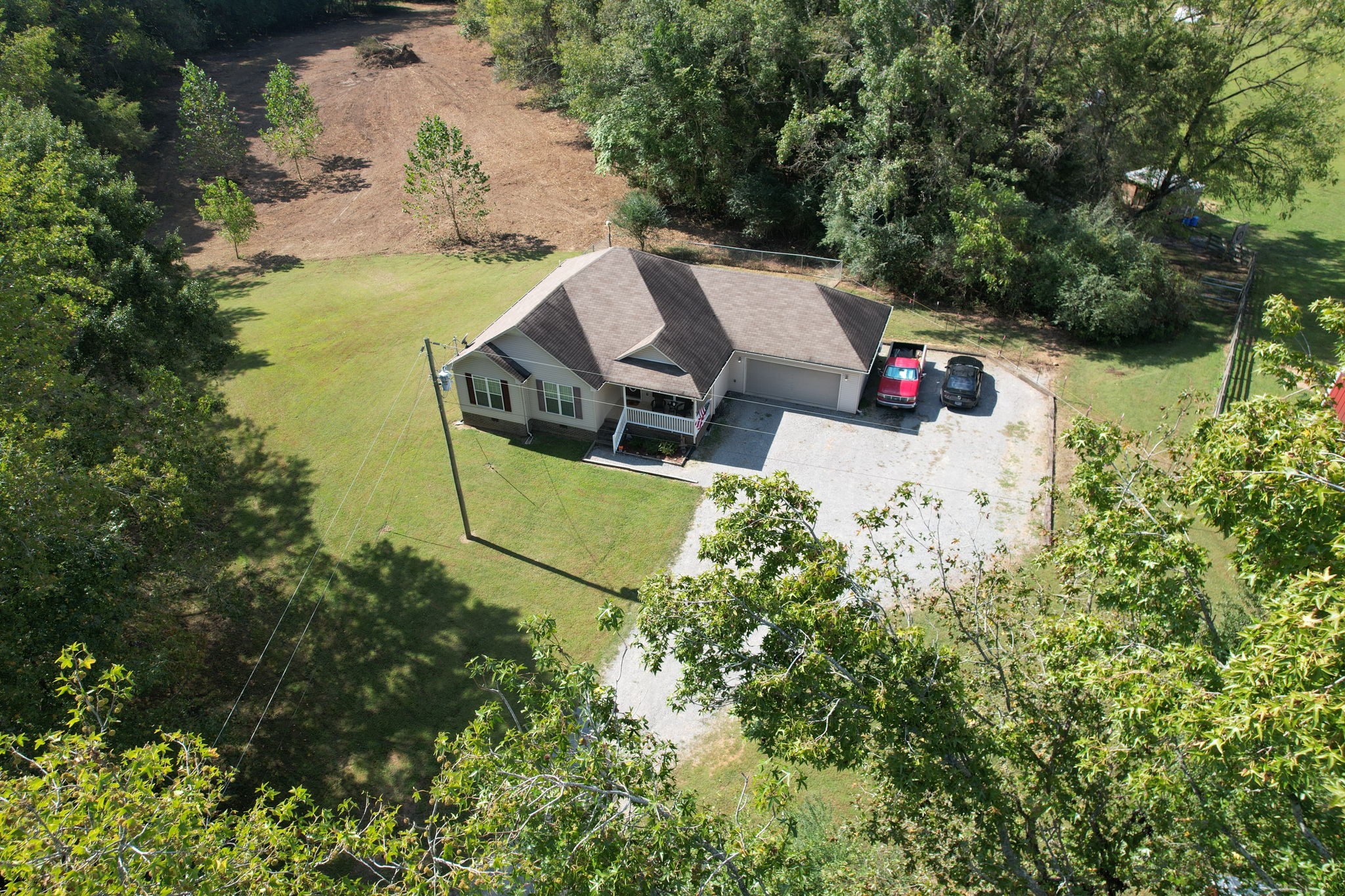 121 Wells Lee Road Elora, TN 37328 - Photo 39 of 48 an aerial view of a house with swimming pool and garden
