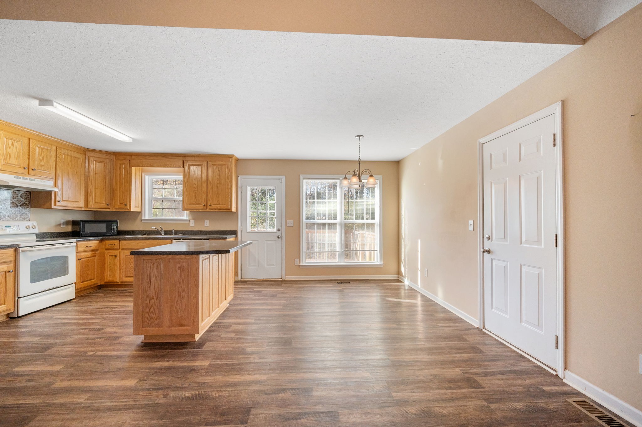 121 Wells Lee Road Elora, TN 37328 - Photo 4 of 48 a large kitchen with a large counter top space a sink stainless steel appliances and cabinets