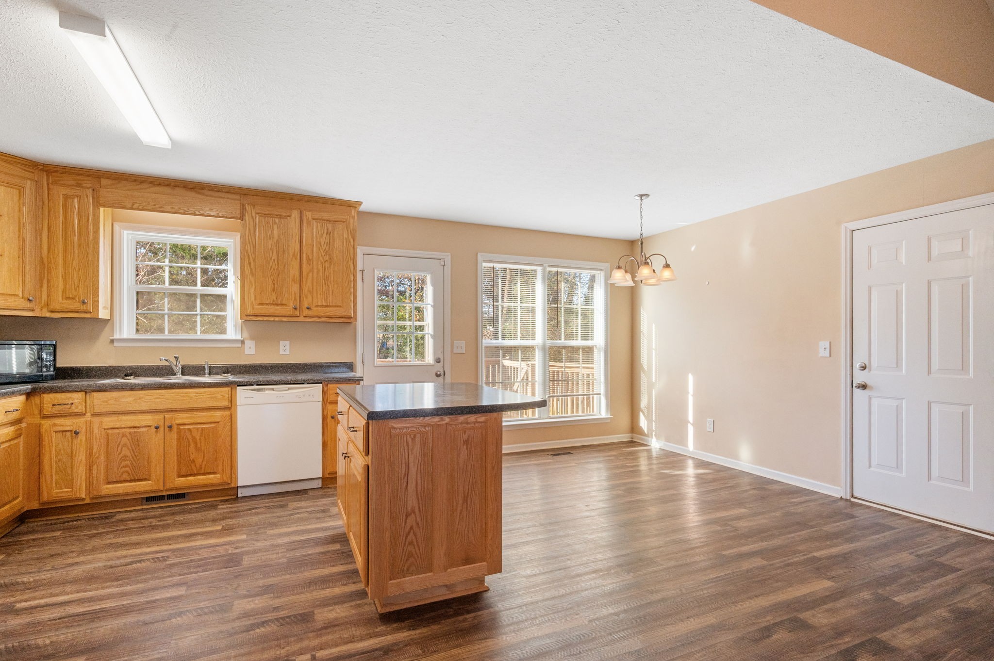 121 Wells Lee Road Elora, TN 37328 - Photo 5 of 48 an empty room with wooden floor and windows