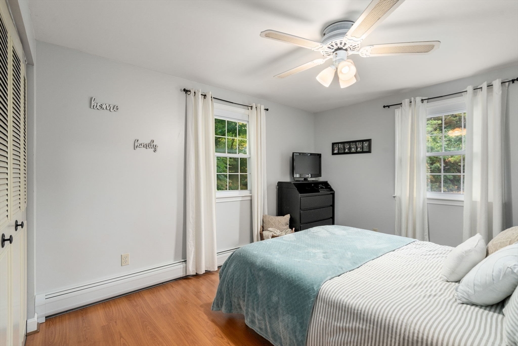 36 Depot Road Templeton, MA 01468 - Photo 13 of 38 a bedroom with a bed and a chandelier