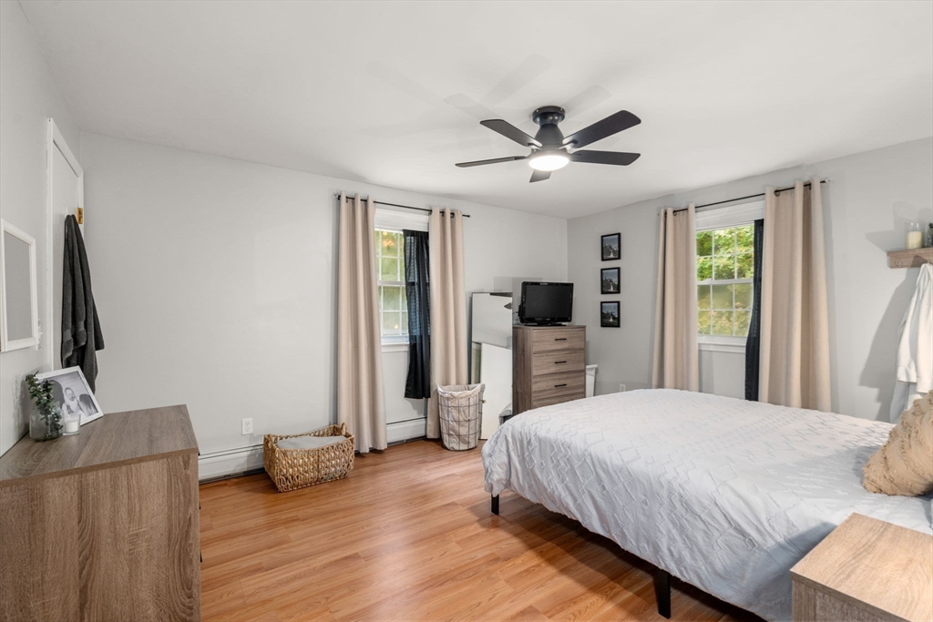 36 Depot Road Templeton, MA 01468 - Photo 15 of 38 a spacious bedroom with a bed and a flat screen tv