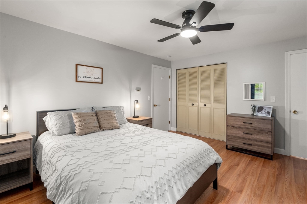 36 Depot Road Templeton, MA 01468 - Photo 16 of 38 a bedroom with a bed and a chandelier