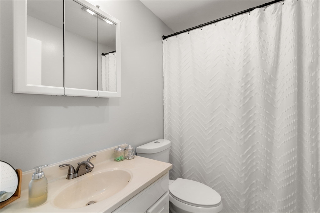 36 Depot Road Templeton, MA 01468 - Photo 18 of 38 a bathroom with a sink a toilet and a mirror