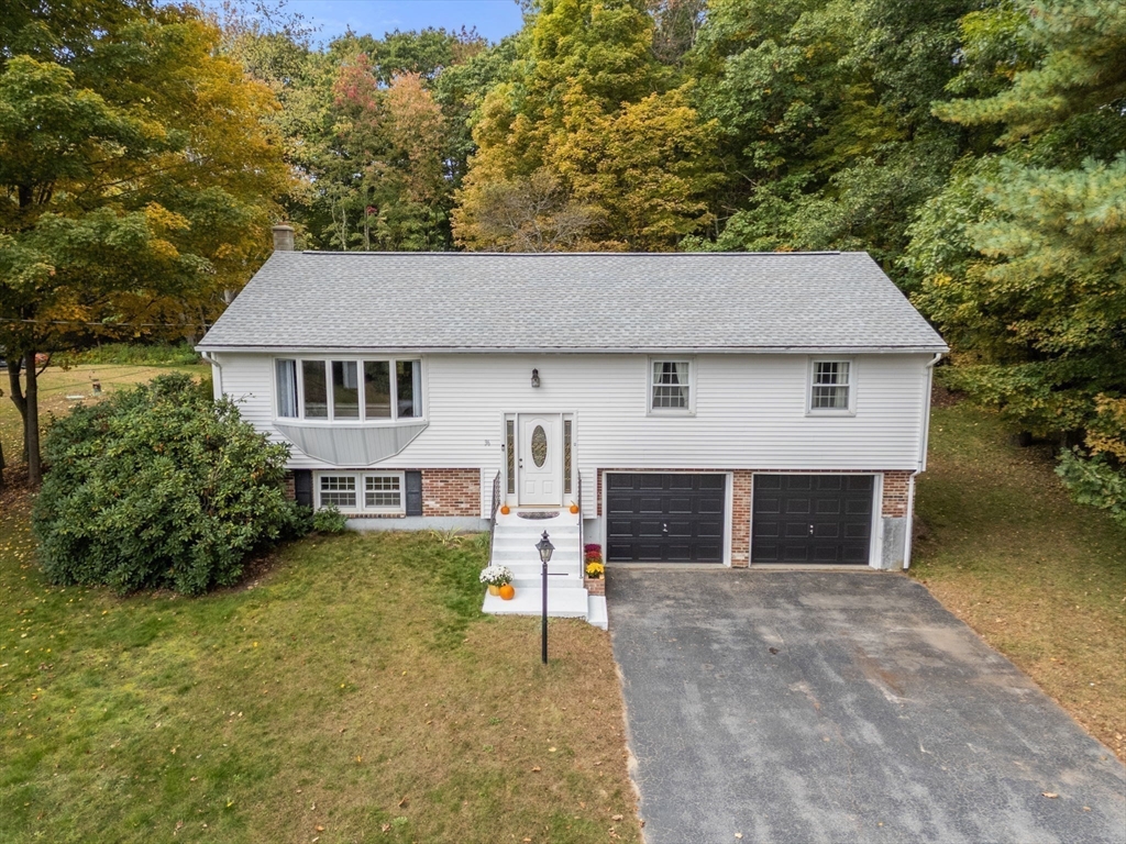 36 Depot Road Templeton, MA 01468 - Photo 2 of 38 a front view of a house with a yard and garage