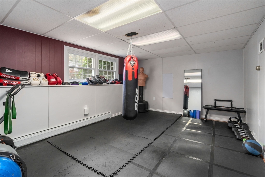 36 Depot Road Templeton, MA 01468 - Photo 23 of 38 a living room with furniture gym equipment and a large window