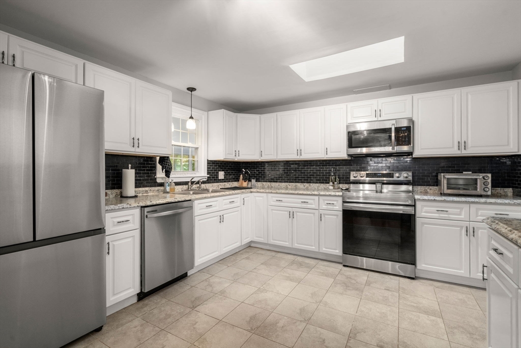 36 Depot Road Templeton, MA 01468 - Photo 9 of 38 a kitchen with granite countertop cabinets stainless steel appliances and a counter space