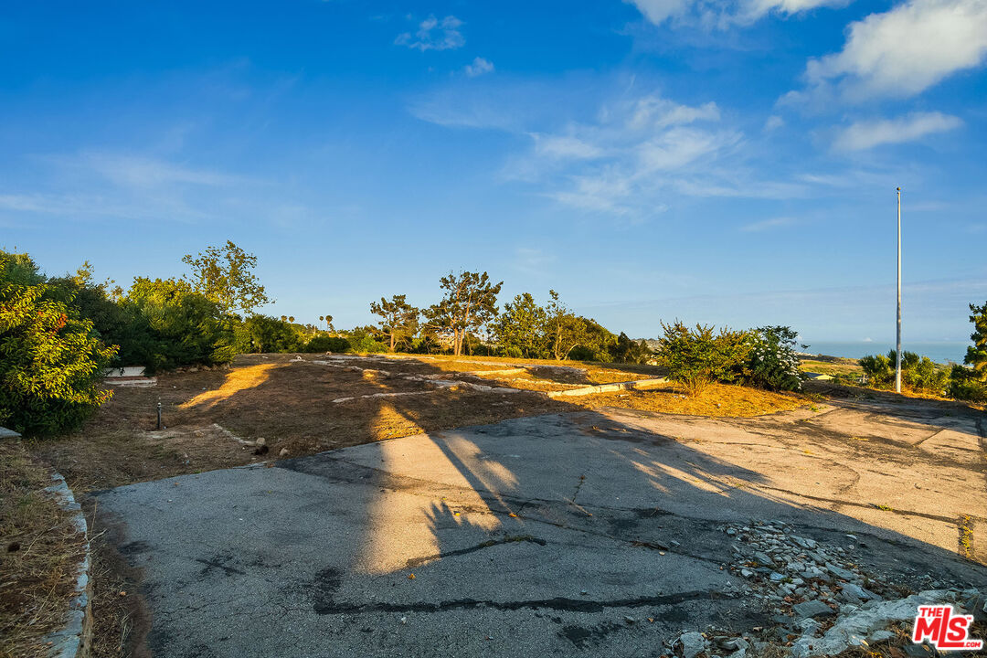 29829 Harvester Road Malibu, CA 90265 - Photo 26 of 44 a view of a beach with a yard