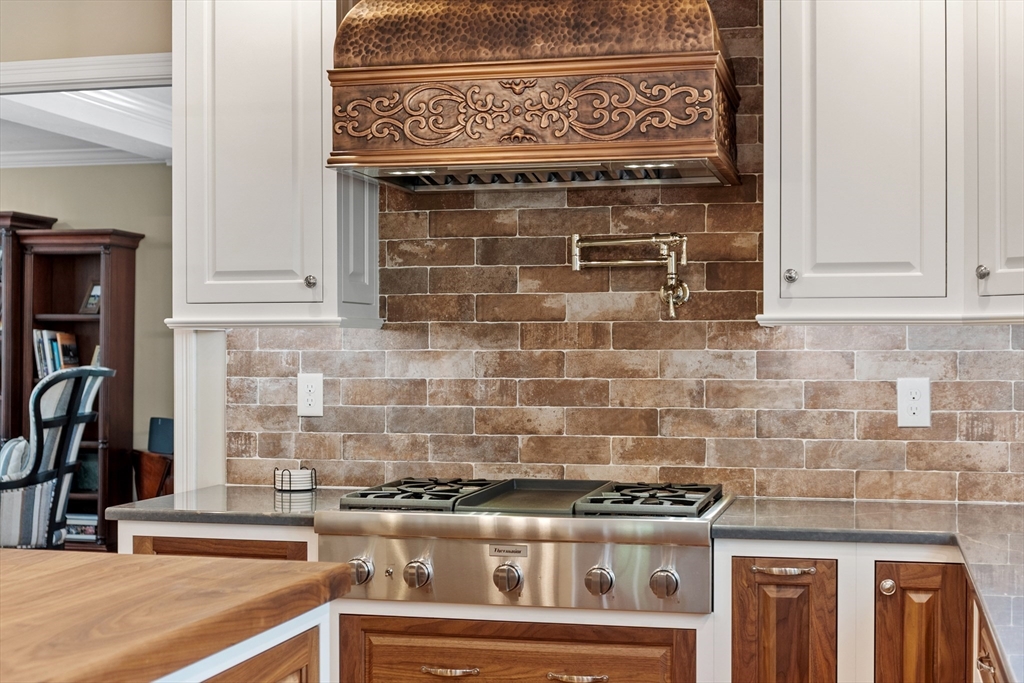 116 Coburn Road Berlin, MA 01503 - Photo 14 of 42 a stove top oven sitting inside of a kitchen