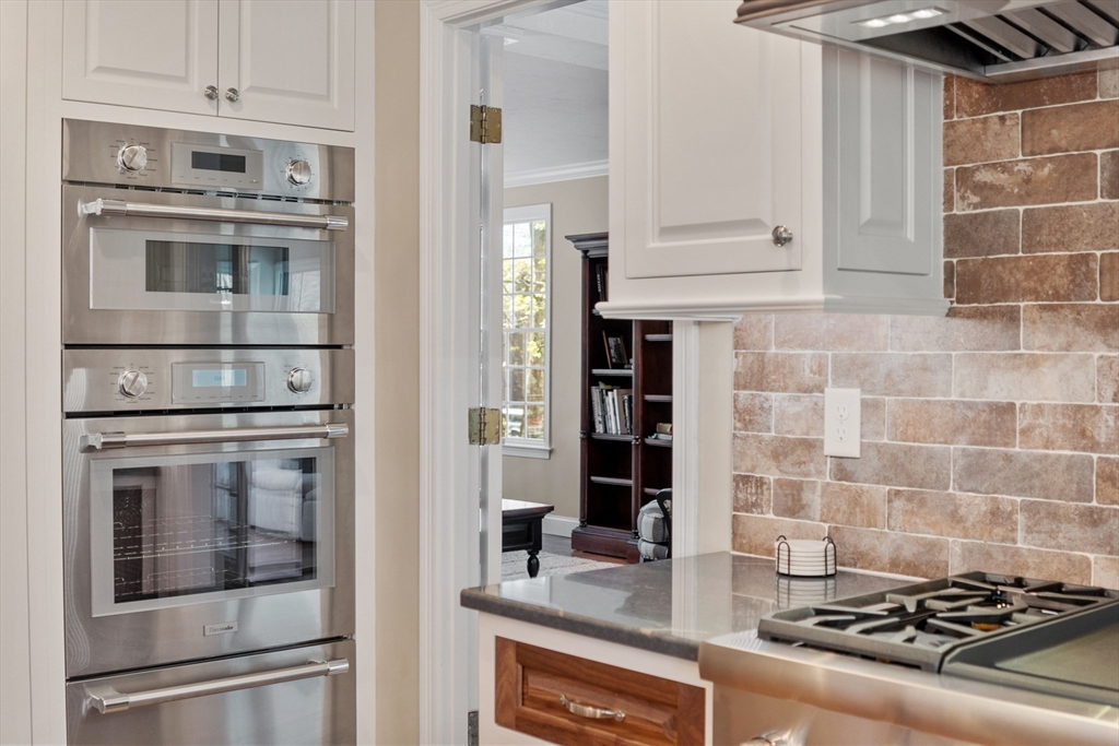 116 Coburn Road Berlin, MA 01503 - Photo 15 of 42 a kitchen with stainless steel appliances granite countertop a stove and a microwave