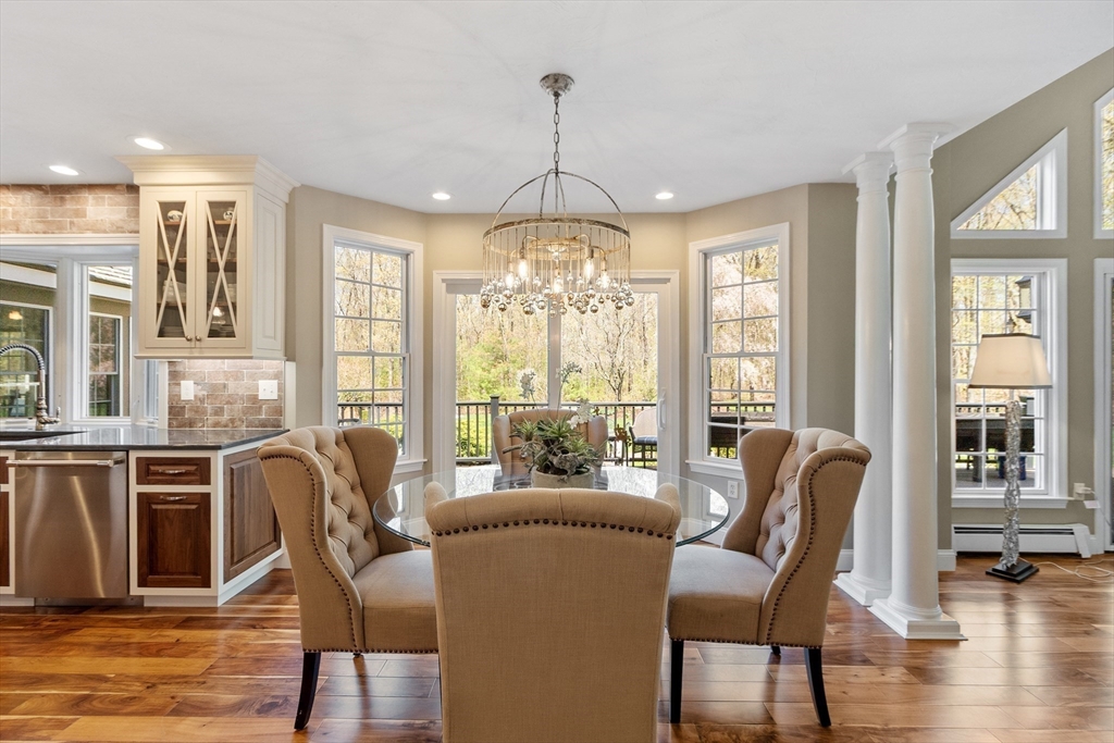 116 Coburn Road Berlin, MA 01503 - Photo 18 of 42 a view of a dining room with furniture window and wooden floor