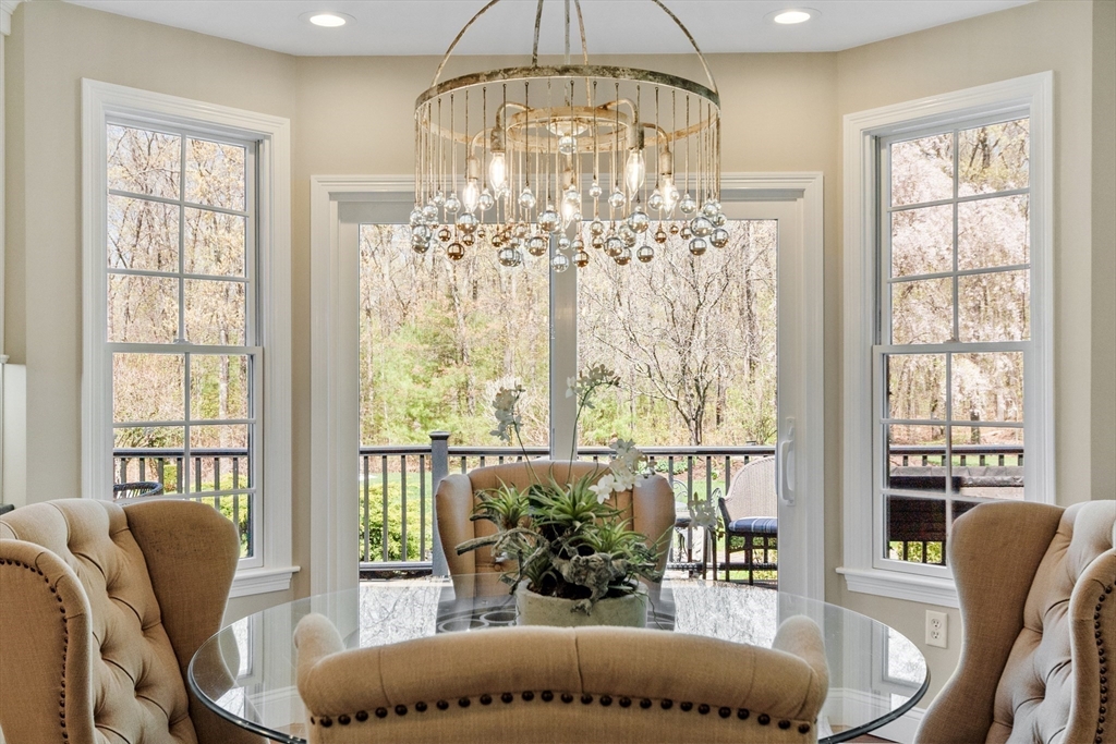 116 Coburn Road Berlin, MA 01503 - Photo 19 of 42 a living room with furniture and a chandelier