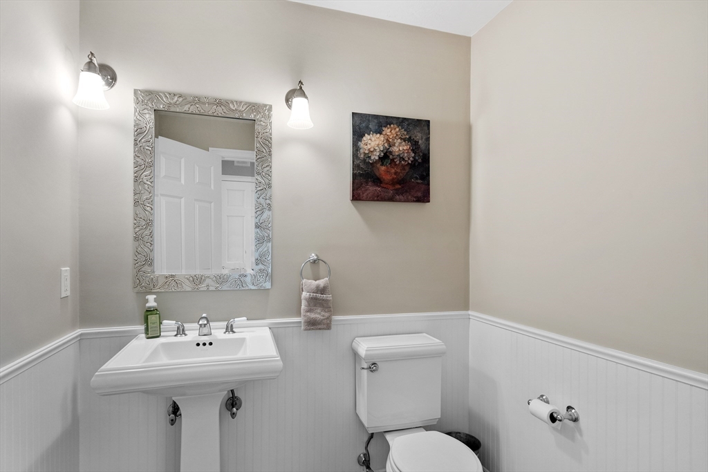 116 Coburn Road Berlin, MA 01503 - Photo 22 of 42 a bathroom with a toilet a sink and mirror