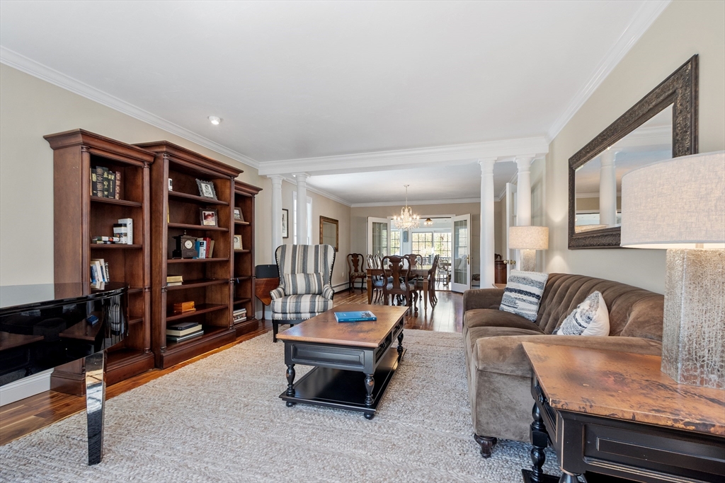116 Coburn Road Berlin, MA 01503 - Photo 6 of 42 a living room with furniture and a bookshelf