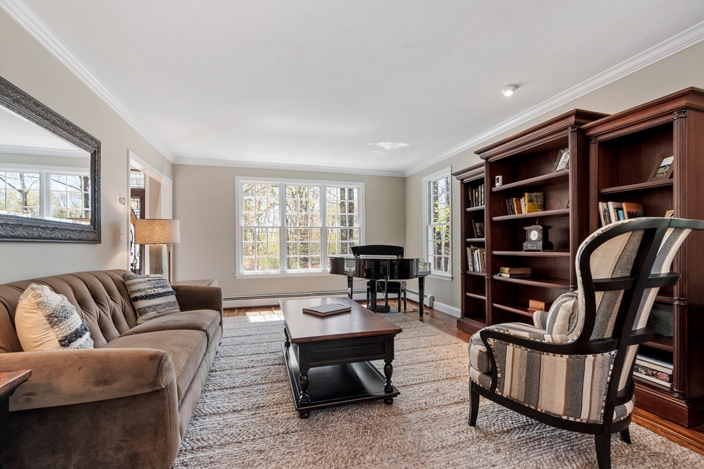 116 Coburn Road Berlin, MA 01503 - Photo 7 of 42 a living room with furniture a rug and a window