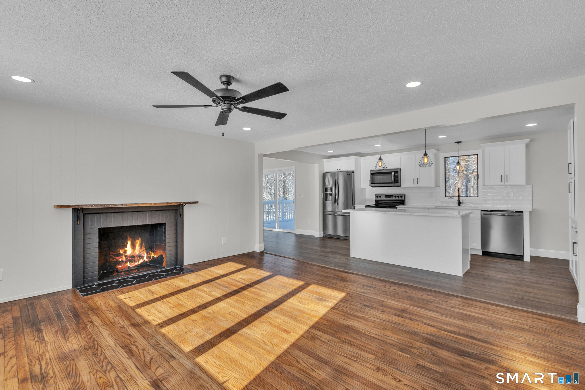22 Mohawk Circle Newington, CT 06111 - Photo 11 of 39 a living room with stainless steel appliances kitchen island a fireplace and a fireplace