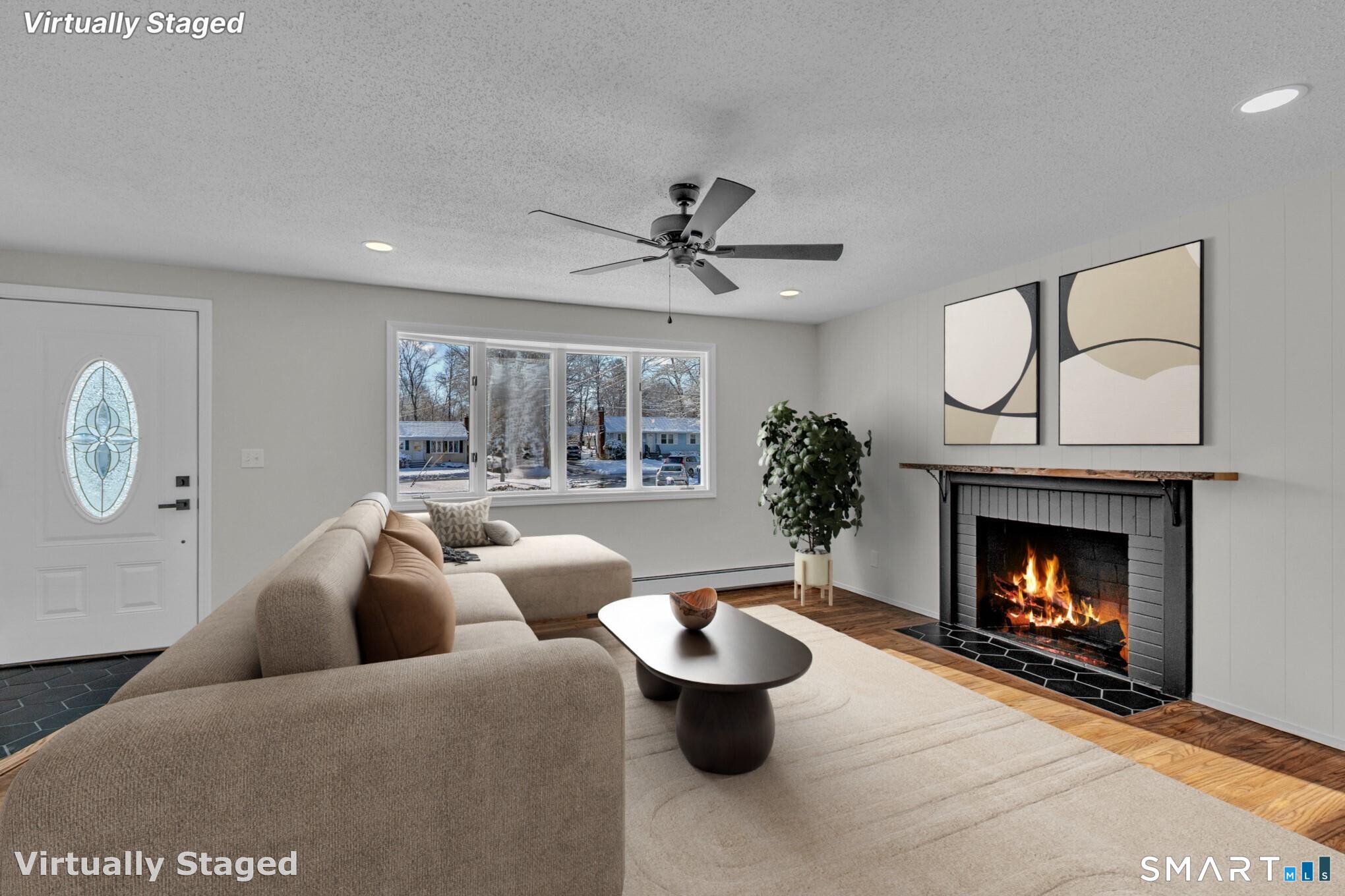 22 Mohawk Circle Newington, CT 06111 - Photo 12 of 39 a living room with furniture and a fireplace