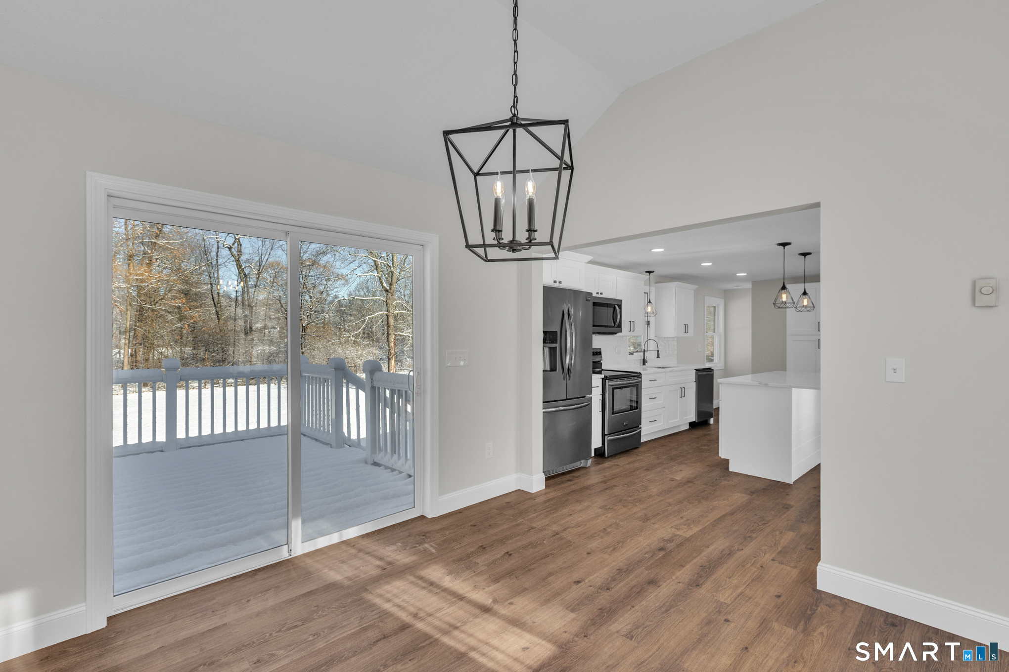 22 Mohawk Circle Newington, CT 06111 - Photo 15 of 39 a view of a kitchen with refrigerator and wooden floor