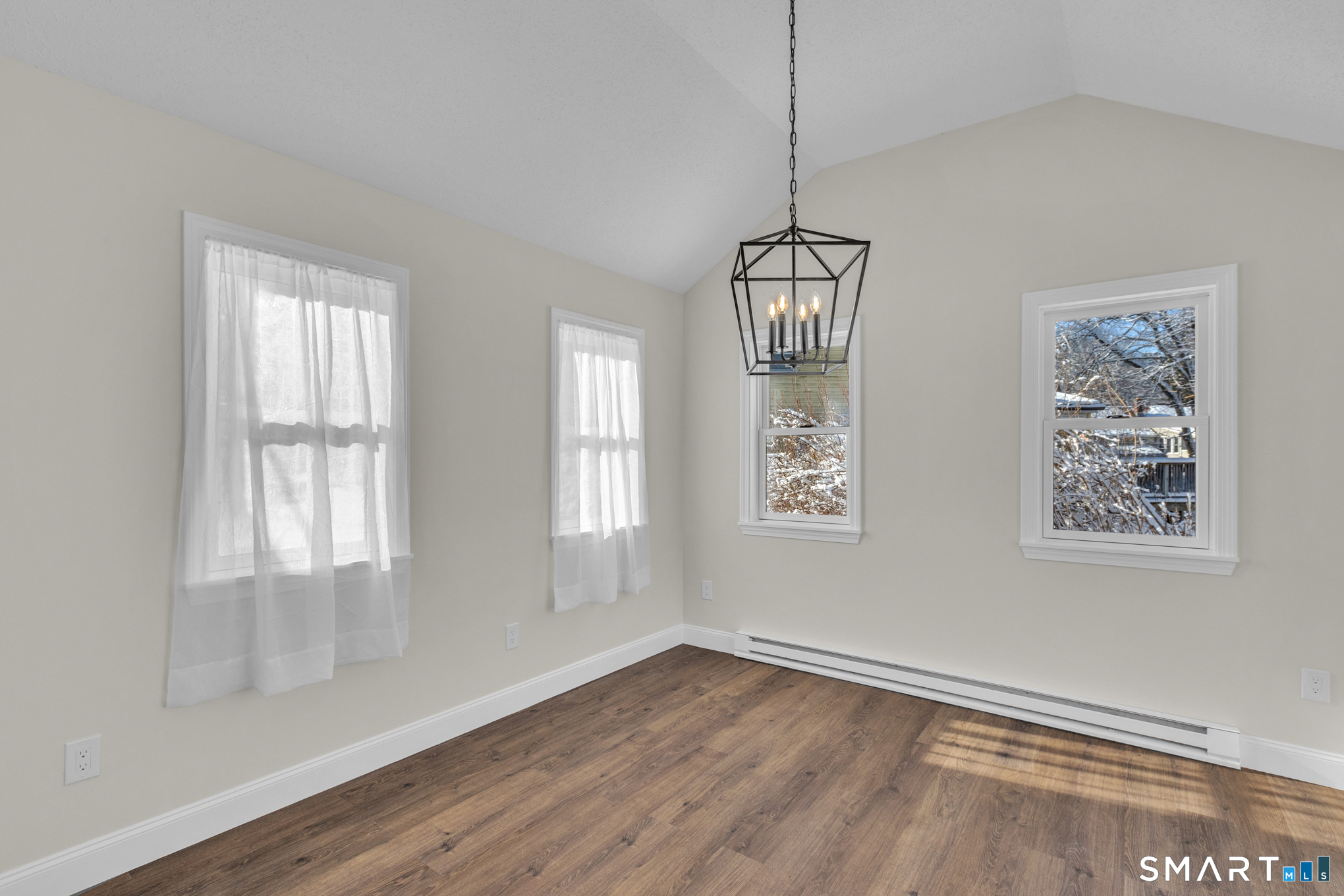 22 Mohawk Circle Newington, CT 06111 - Photo 16 of 39 a view of an empty room with a window and wooden floor