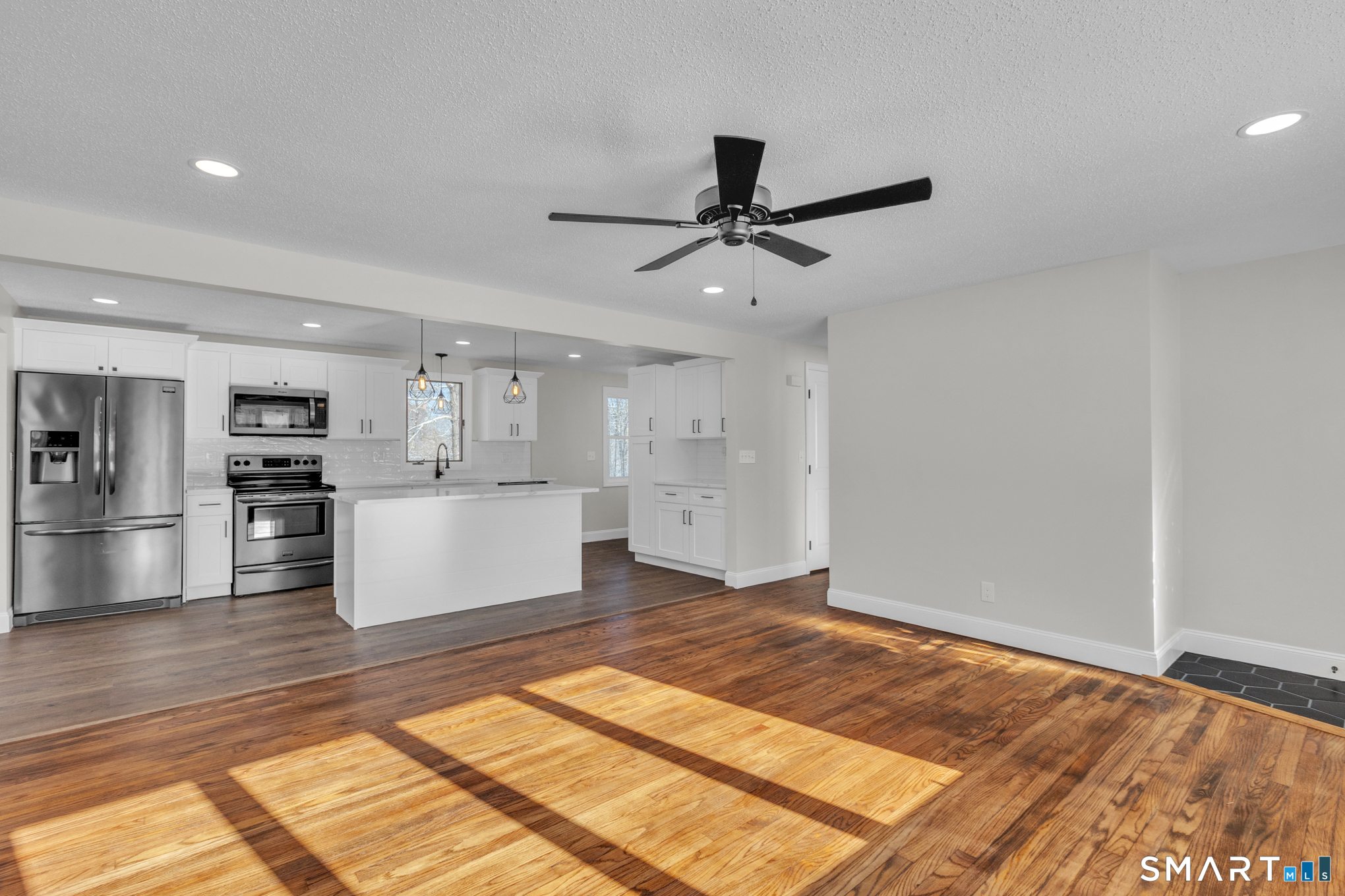 22 Mohawk Circle Newington, CT 06111 - Photo 17 of 39 a view of kitchen with wooden floor and window