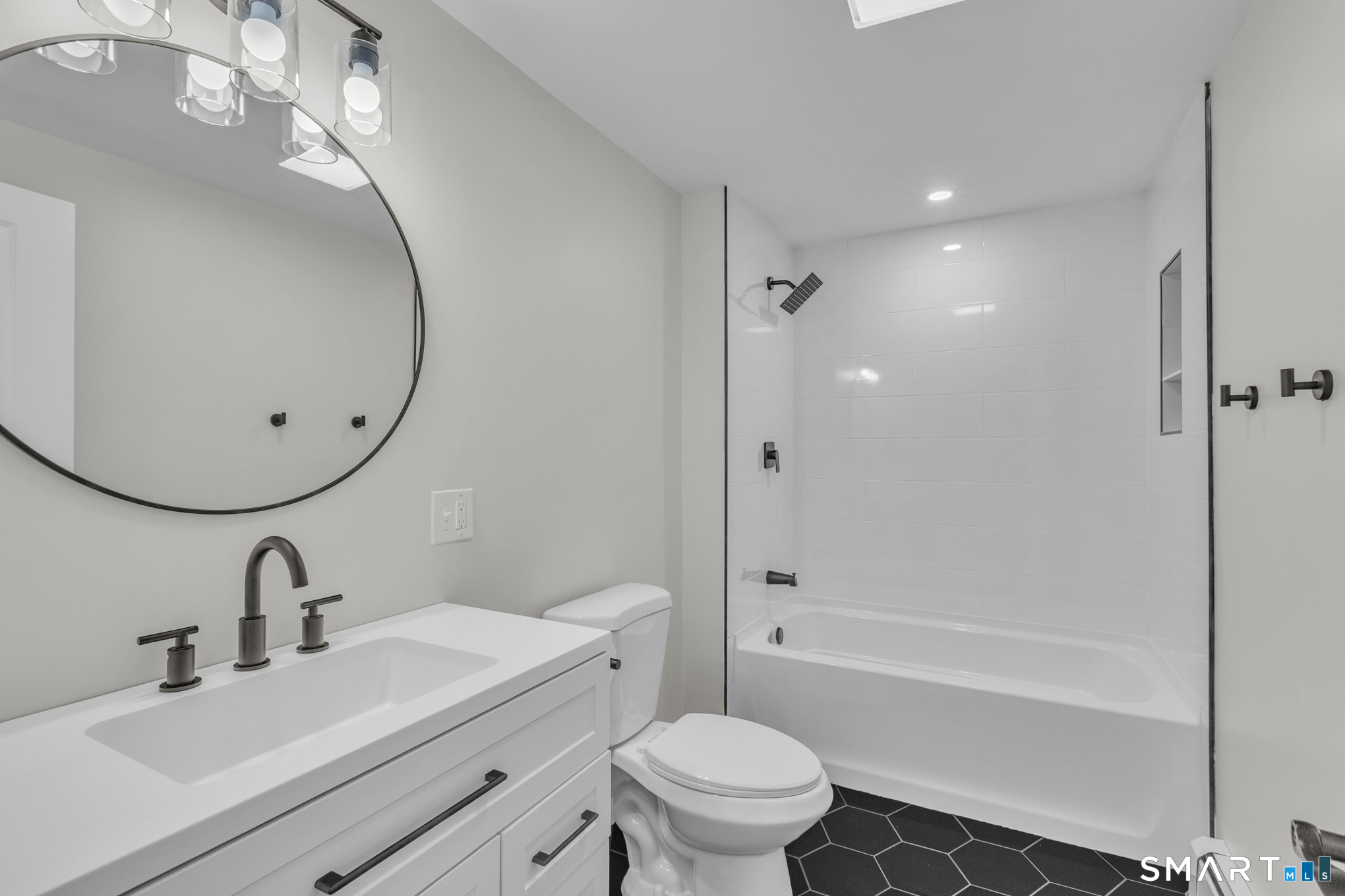 22 Mohawk Circle Newington, CT 06111 - Photo 22 of 39 a bathroom with a sink a toilet and a mirror