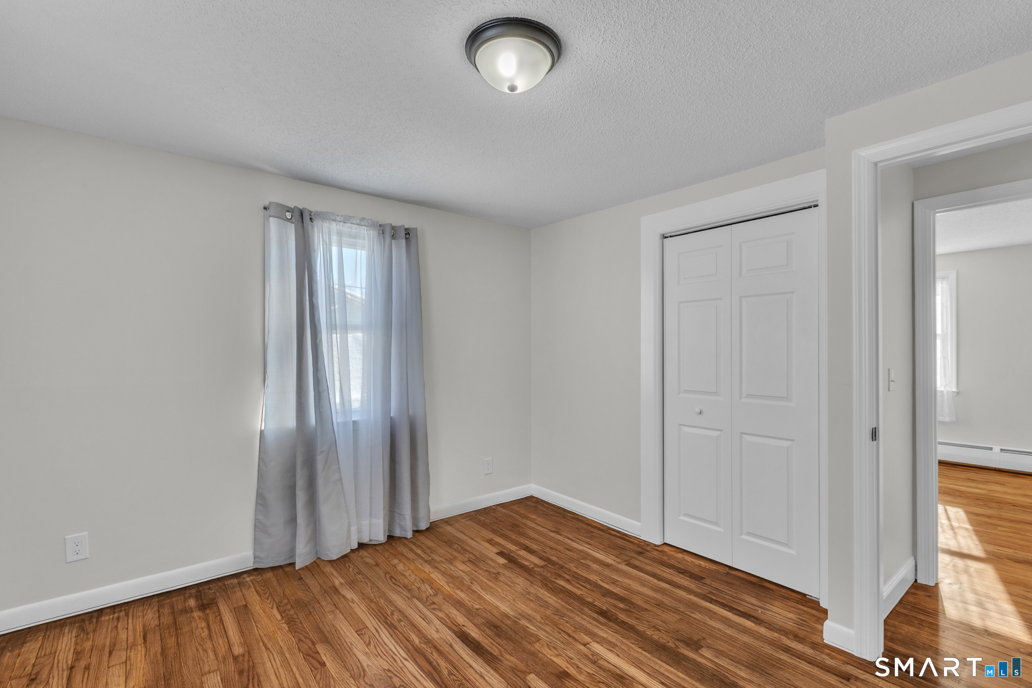 22 Mohawk Circle Newington, CT 06111 - Photo 30 of 39 wooden floor in an empty room