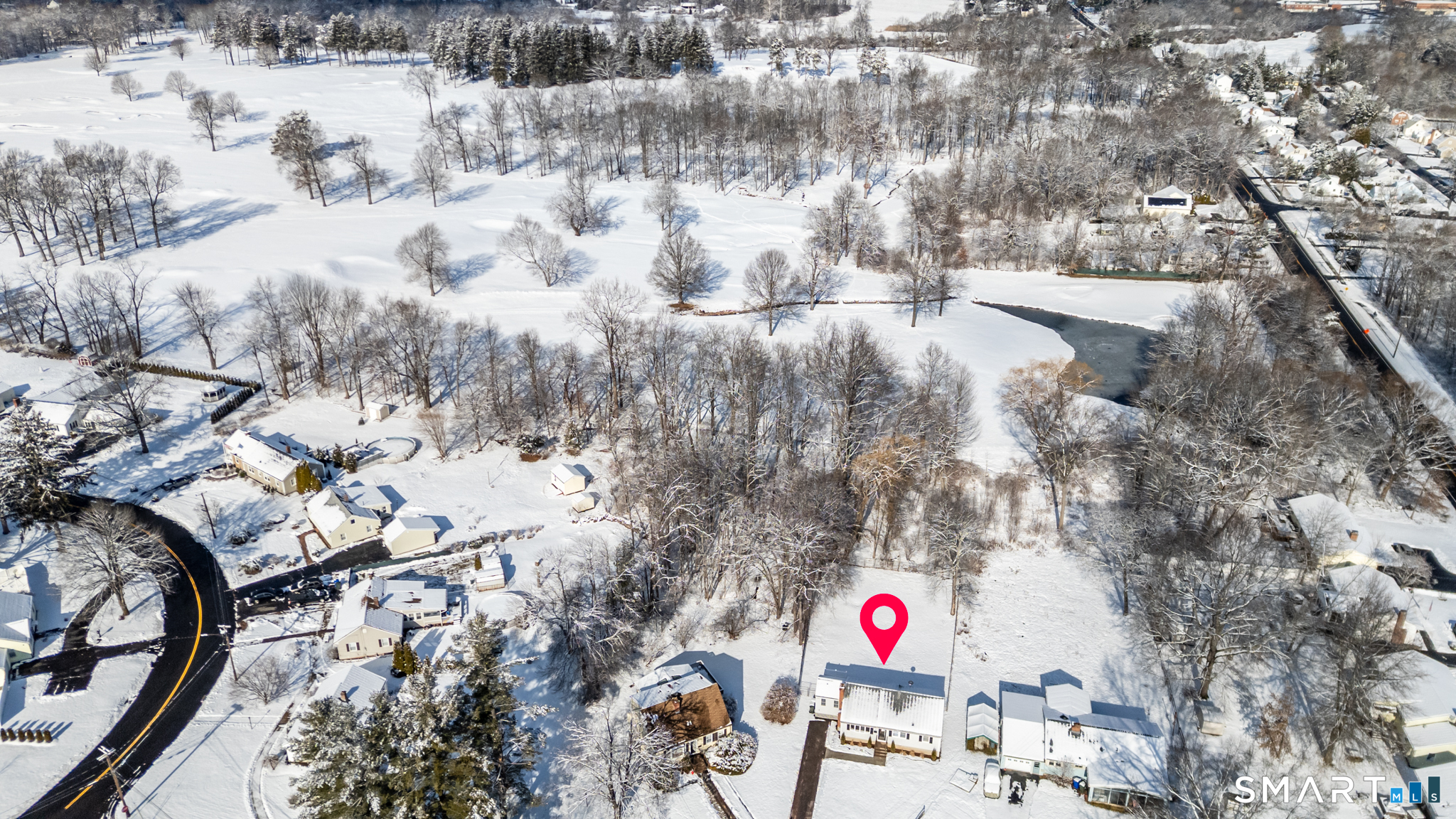 22 Mohawk Circle Newington, CT 06111 - Photo 3 of 39 a view of lot of trees and snow on side of road