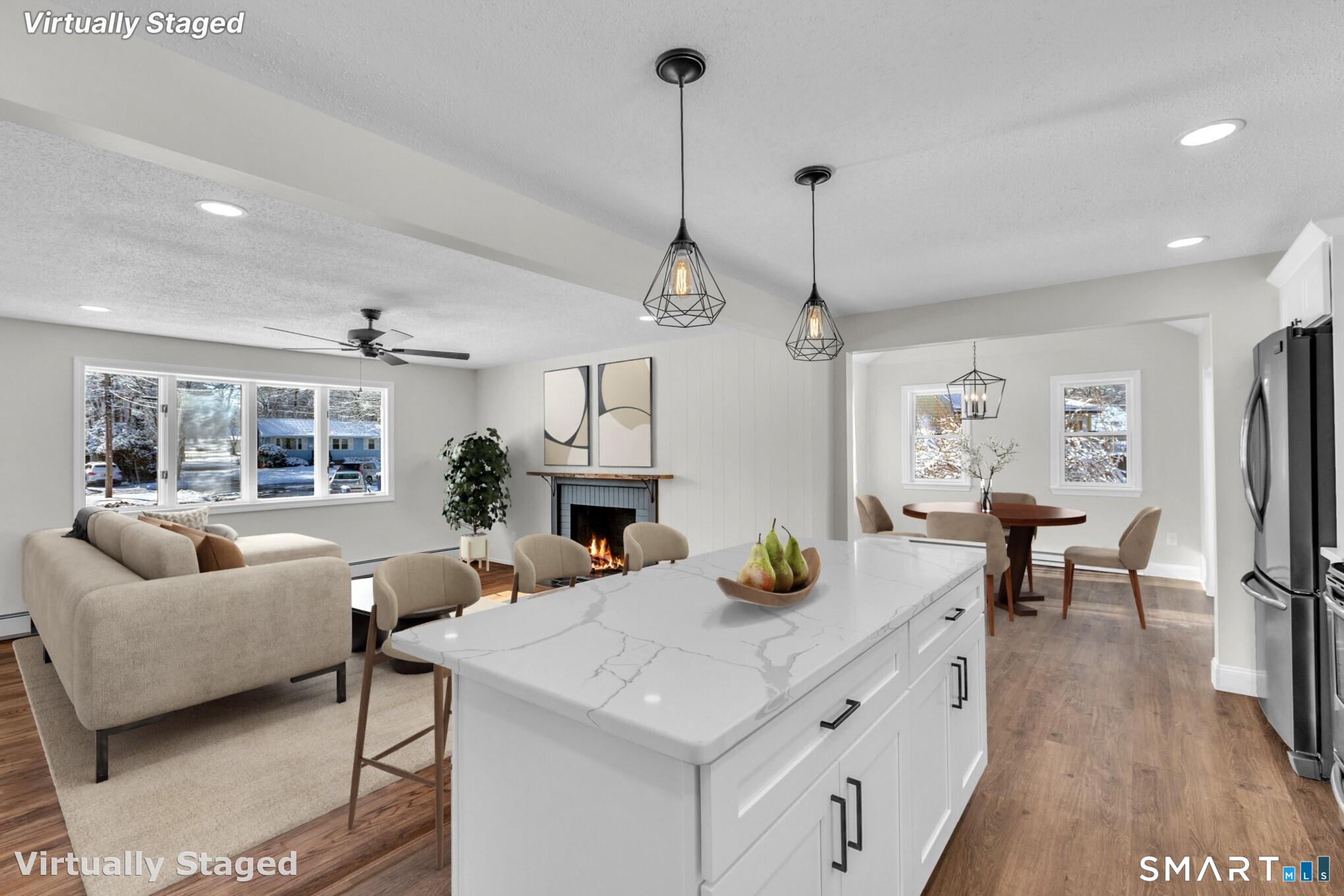 22 Mohawk Circle Newington, CT 06111 - Photo 4 of 39 a kitchen with sink refrigerator dining table and chairs