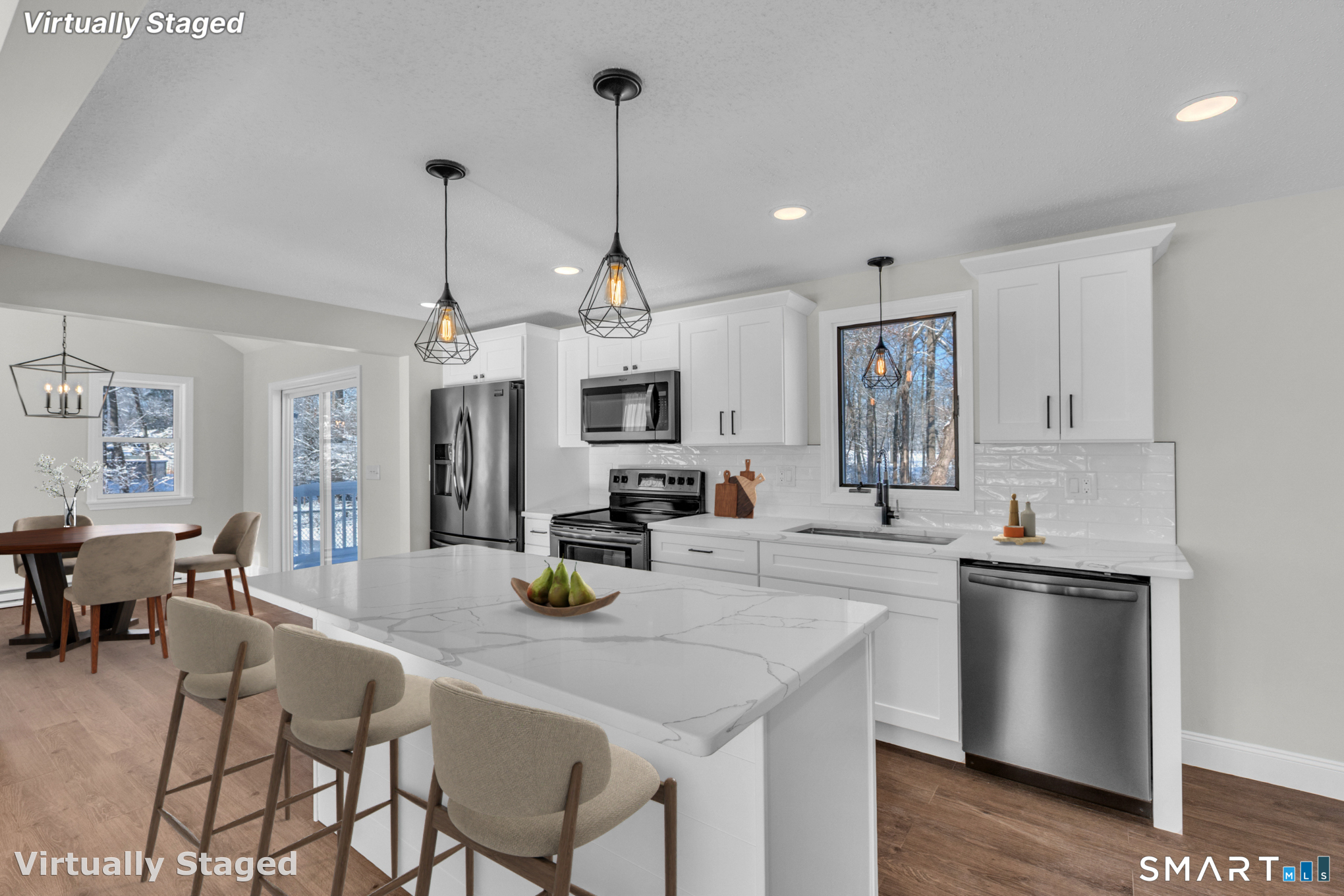 22 Mohawk Circle Newington, CT 06111 - Photo 6 of 39 a kitchen with stainless steel appliances kitchen island granite countertop a sink a stove a dining table and chairs with wooden floor