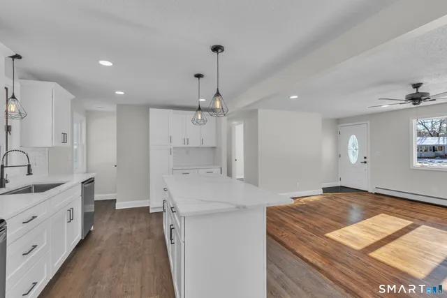 a kitchen with a sink stove and refrigerator