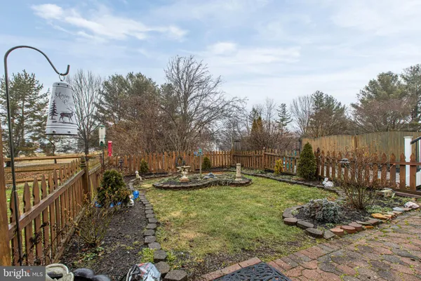 a view of a backyard with sitting area