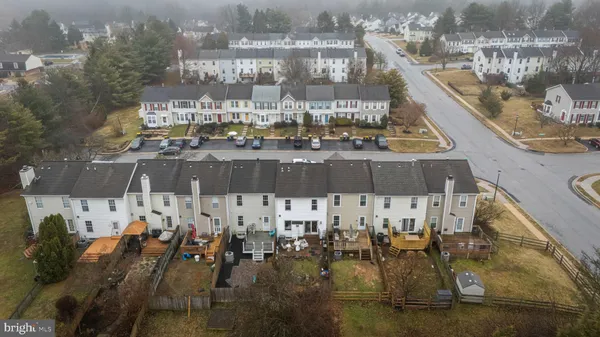 a balcony with chairs and tables