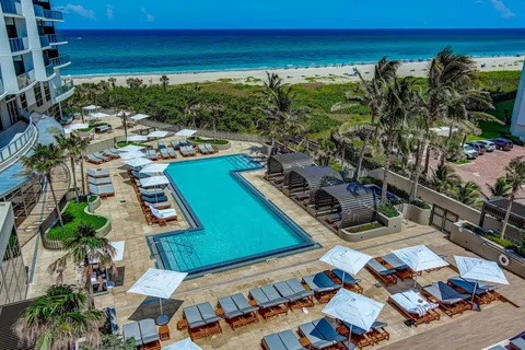 a view of a balcony with chairs and a table