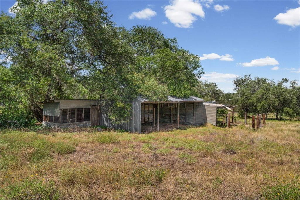 13501 Nutty Brown Road, Unit B Austin, TX 78737 - Photo 24 of 29 A rural setting with a weathered shed offers potential for agricultural endeavors.