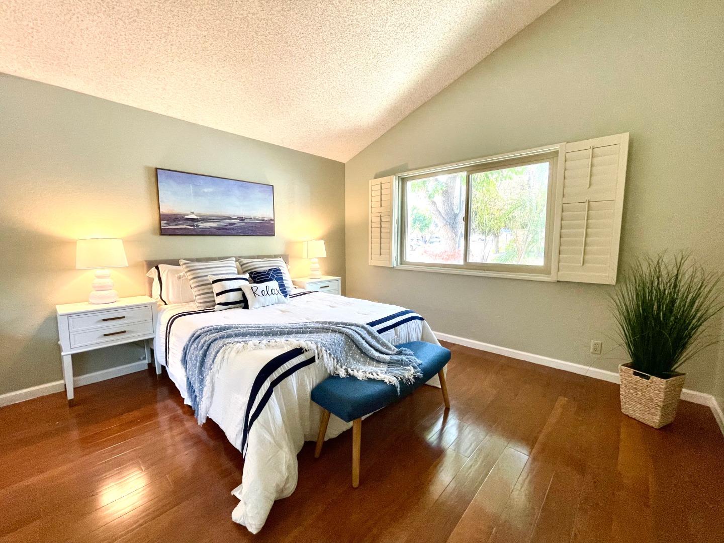 22801 Longdown Road Cupertino, CA 95014 - Photo 15 of 25 a bedroom with bed and wooden floor
