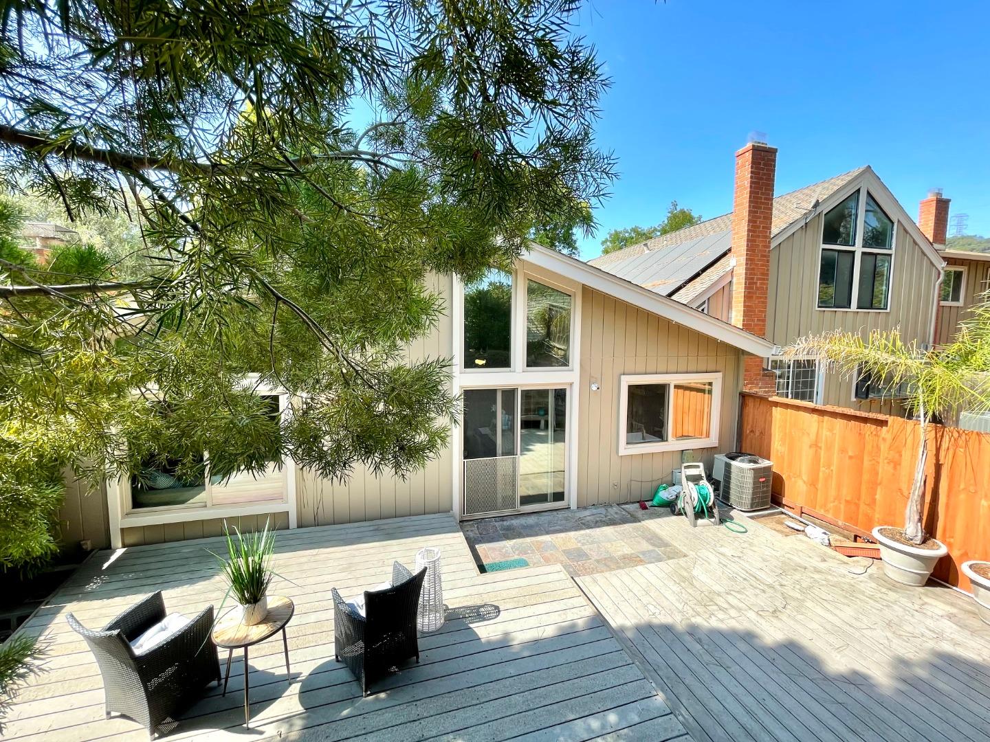 22801 Longdown Road Cupertino, CA 95014 - Photo 19 of 25 a front view of a house with a yard