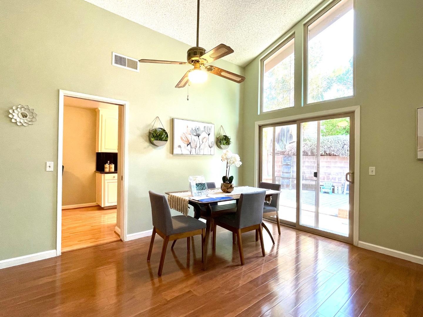 22801 Longdown Road Cupertino, CA 95014 - Photo 3 of 25 a view of a dining room with furniture and wooden floor