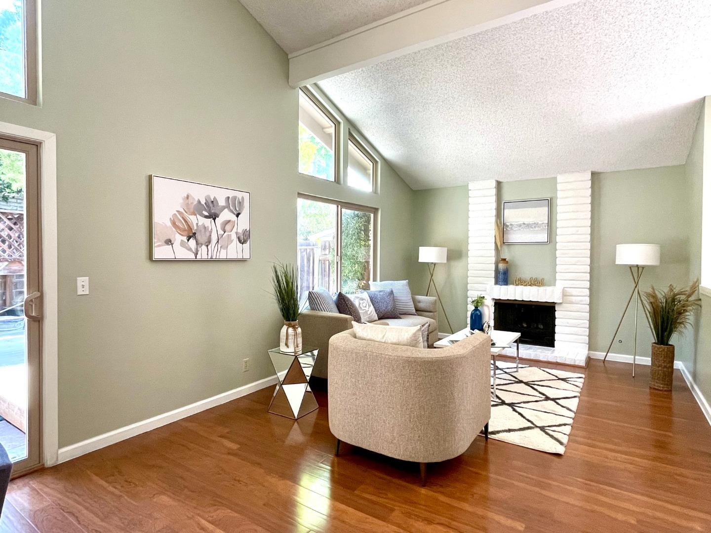 22801 Longdown Road Cupertino, CA 95014 - Photo 4 of 25 a living room with furniture floor to ceiling window and wooden floor