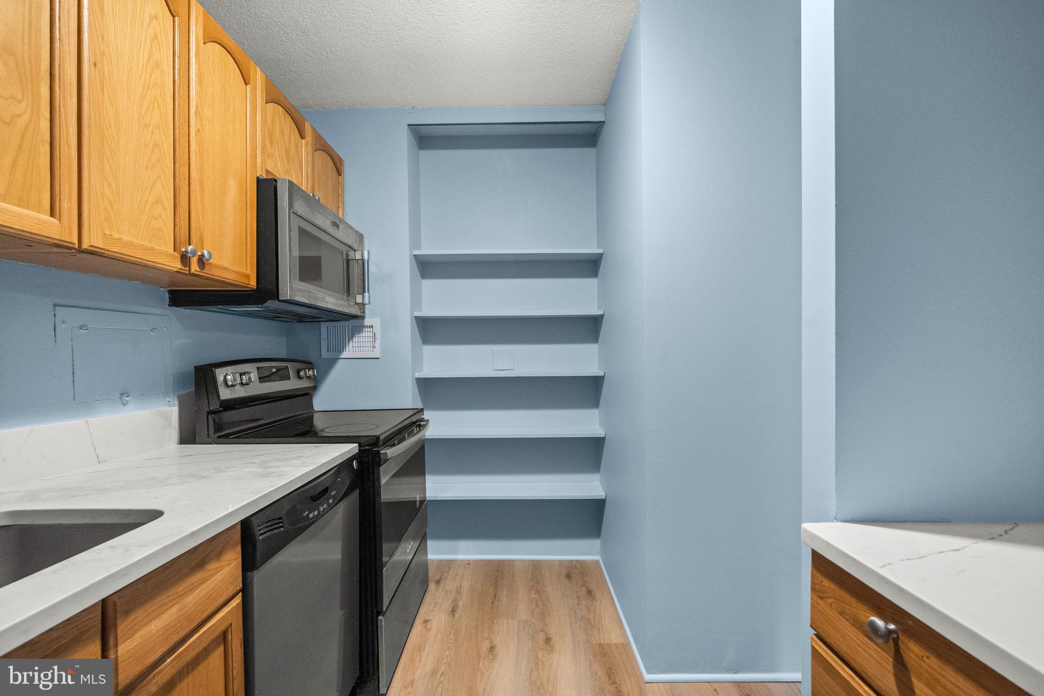 1718 P Street Northwest, Unit 316 Washington, DC 20036 - Photo 18 of 32 a kitchen with a sink and a stove top oven