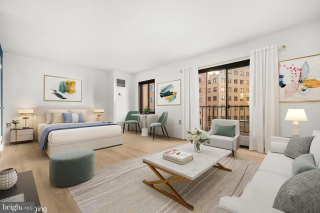 a living room with furniture rug and window