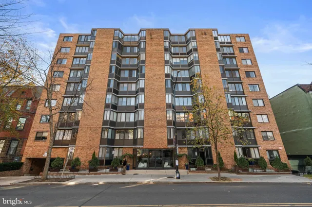 a lobby with furniture and floor to ceiling window