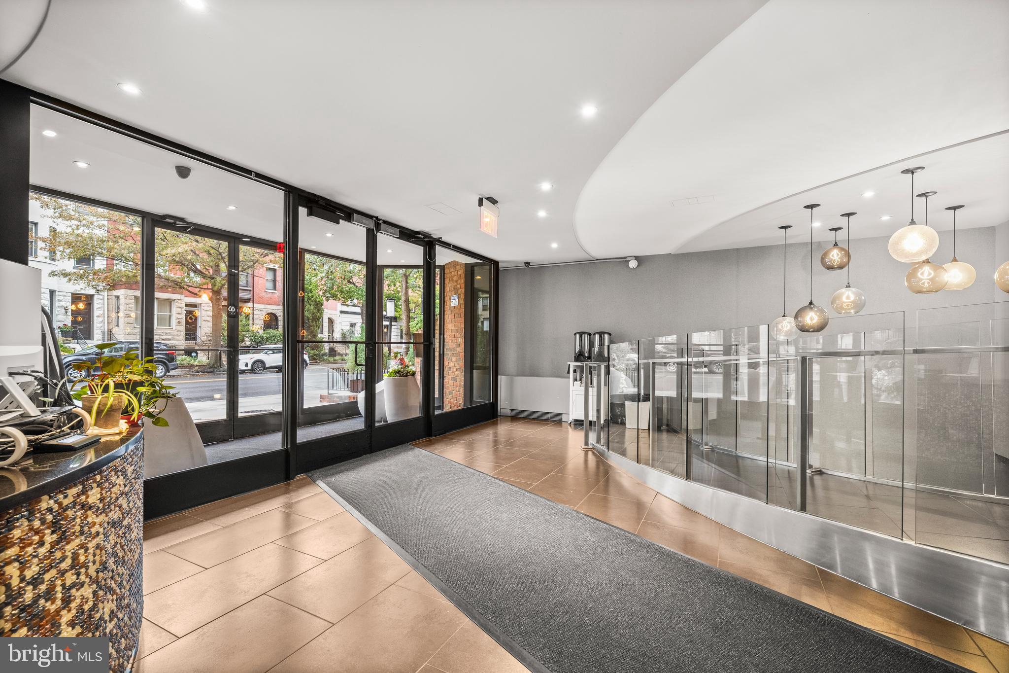 1718 P Street Northwest, Unit 316 Washington, DC 20036 - Photo 25 of 32 a lobby with furniture and floor to ceiling window