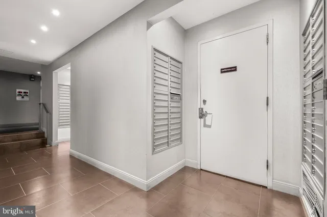 a view of an empty room and a windows