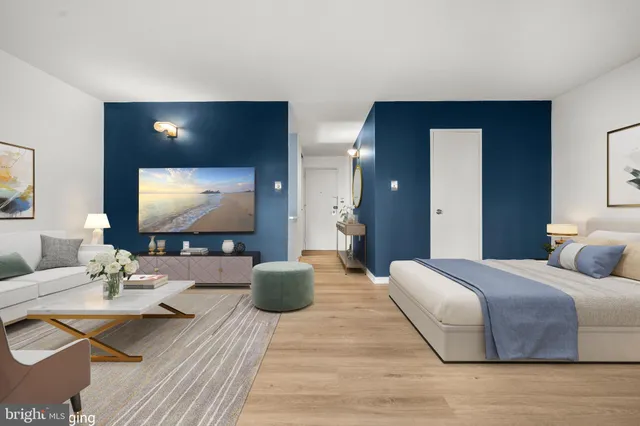 a living room with couches and a flat screen tv