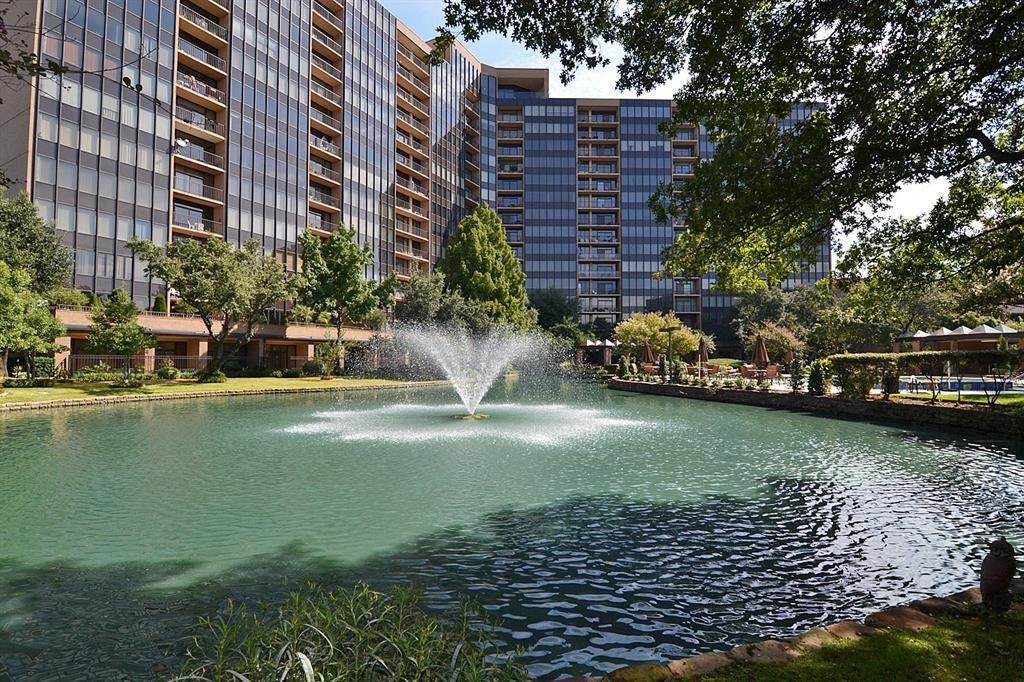 5200 Keller Springs Road, Unit 615 Dallas, TX 75248 - Photo 1 of 9 a view of a lake with a building