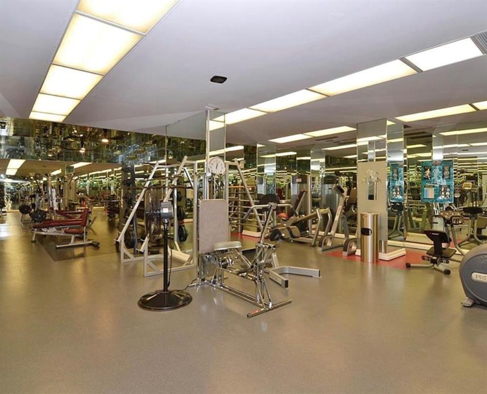 5200 Keller Springs Road, Unit 615 Dallas, TX 75248 - Photo 3 of 9 a view of a room with gym equipment