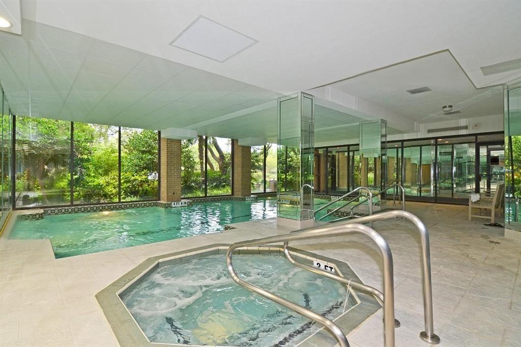 5200 Keller Springs Road, Unit 615 Dallas, TX 75248 - Photo 5 of 9 a swimming pool with outdoor seating and yard