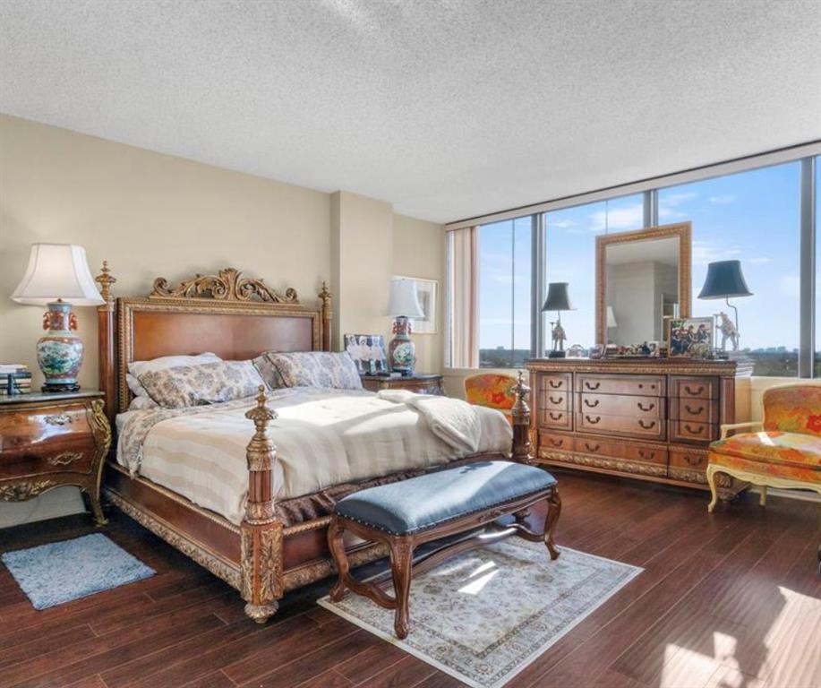 5200 Keller Springs Road, Unit 615 Dallas, TX 75248 - Photo 9 of 9 a bed room with a bed window and a chair