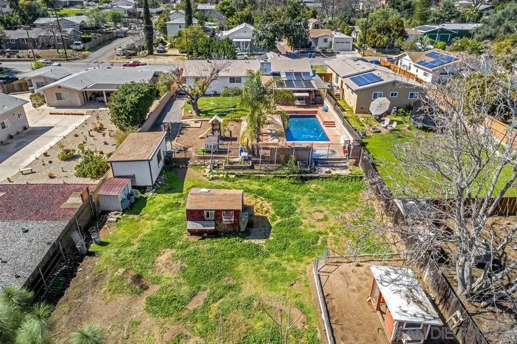 8311 Sunset Road Lakeside, CA 92040 - Photo 24 of 25 an aerial view of a house with swimming pool and ocean view