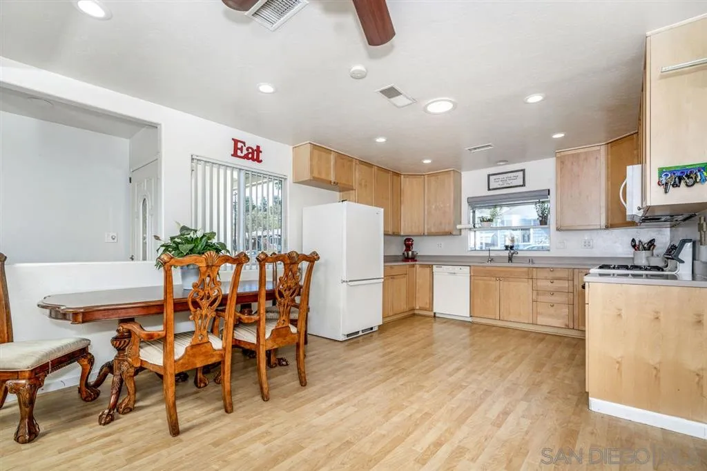 8311 Sunset Road Lakeside, CA 92040 - Photo 3 of 25 a kitchen with furniture and wooden floor
